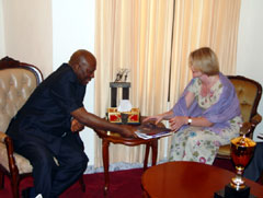 President Kabbah receiving books from the First Secretary of the Ireland Development Cooperation Directorate, Ms. Aine Hearns