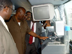 President Kabbah inspecting the refrigerator, TV and Video system in one of the buses