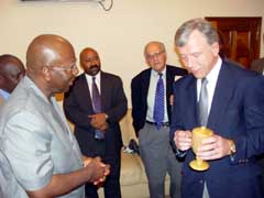 A piece of artwork being received by President Kabbah