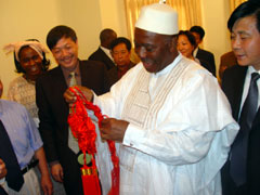 President Kabbah inspecting a Chinese manufactured item