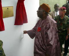 President Kabbah opening the plaque