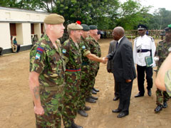 President Kabbah in handshake with members of Infantry Training and Advisory Team (ITAT)