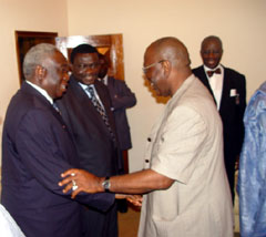 President Kabbah in handshake with Mr. A. Dunstan M'cormack
