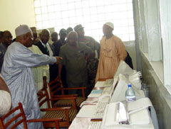 The President, Vice President Berewa and other Sierratel officials on a guided inspection of new computers and fax machines