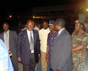 President Kabbah being escorted to a waiting helicopter for Lungi international airport